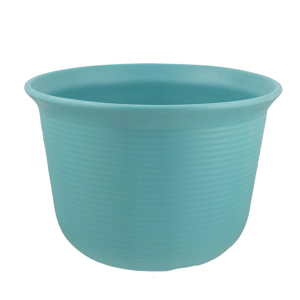 Blue ribbed planter on a white background