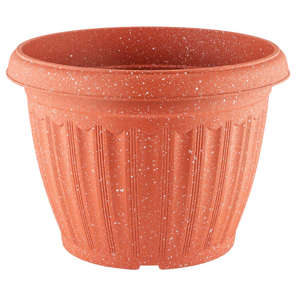 Speckled plastic garden pot in orange on a white background