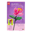 Box of 'Blocks in Bloom' orchid building set with purple background