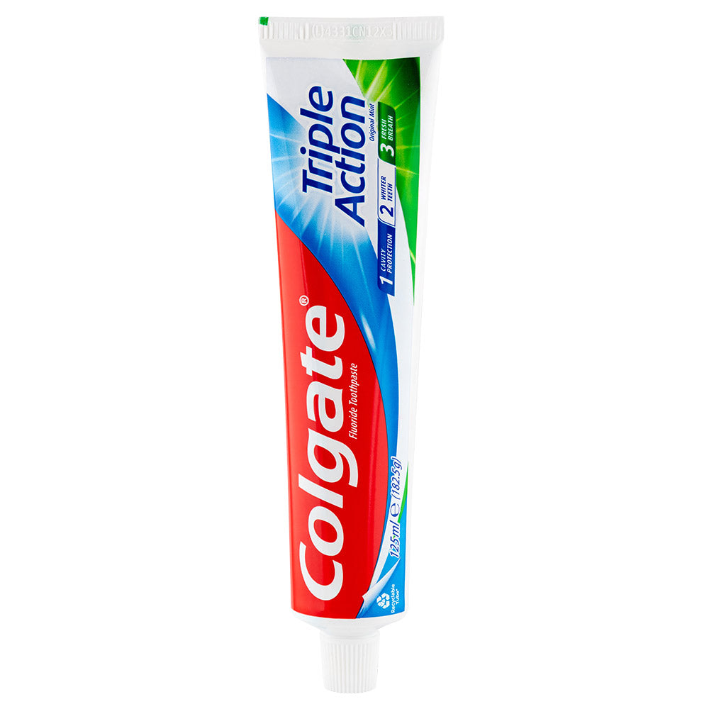 Colgate triple action toothpaste on white background.