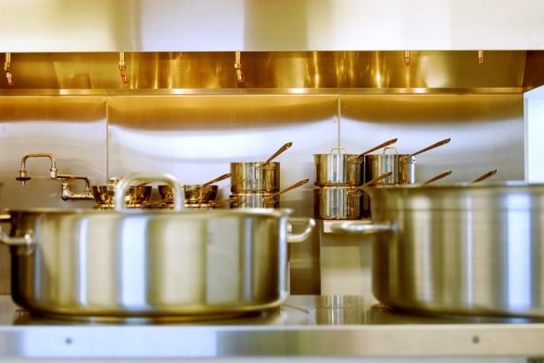 Stainless steel pots in a kitchen setting
